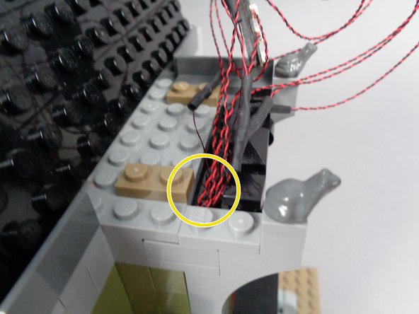 Continue re-assembling the wall as shown in the second and third photos for this step.