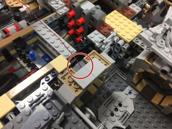 As shown in the first photo, attach the light to the rear part of the door frame.  The light should sit at the back of the frame.