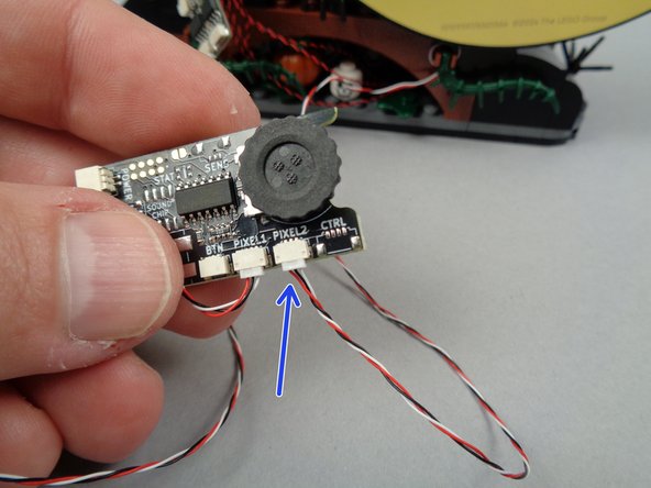 As shown in the photo for this step, you connect the wire for the LED strip to the PIXEL2 plug on the main lighting effect controller.