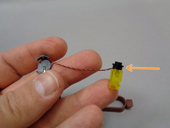 As shown in the first photo, re-attach the round black 1x1 plate to the bottom of the lantern assembly. (orange arrow)