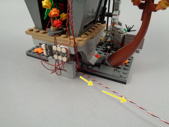 As shown in the third photo for this step, remove the tree to continue routing the 3-wire cable.