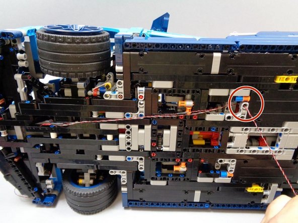 It is important that both wires are routed as shown in the photo, including up and through the Technic hole under the driver's seat.  This is necessary to keep the wires from dragging on the ground.