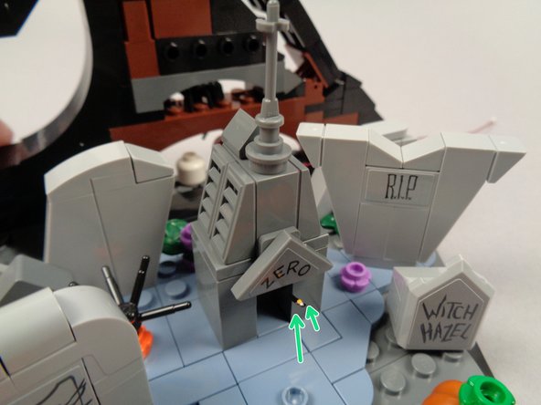 As shown by the green arrows in the second photo for this step, you can gently bend the light upward if needed so it shines onto the nameplate.