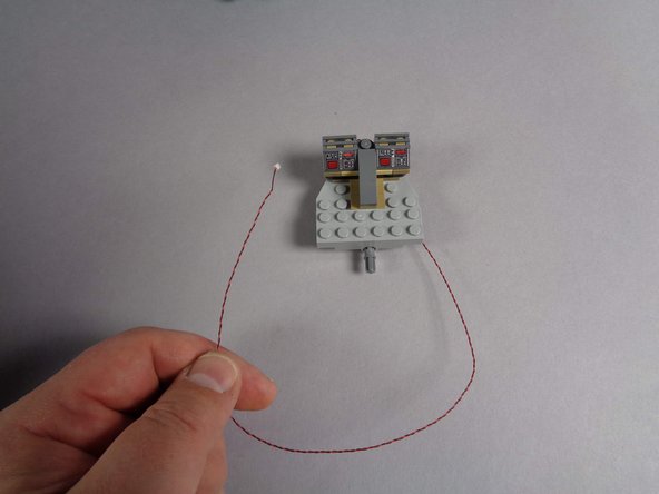 As shown in the second photo for this step, the old cockpit panel light should be a single small plug (orange circle) connected to a BRANCH15 adapter board (orange arrow).