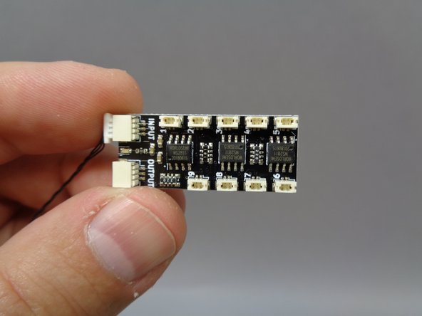 Remove one of the BRANCH09X adapter boards from Bag 7, and as shown  in the first photo, connect one of the 24&quot; three-wire connecting cables (RED OR BLACK) in Bag 7 to the INPUT connector on the BRANCH09X adapter.