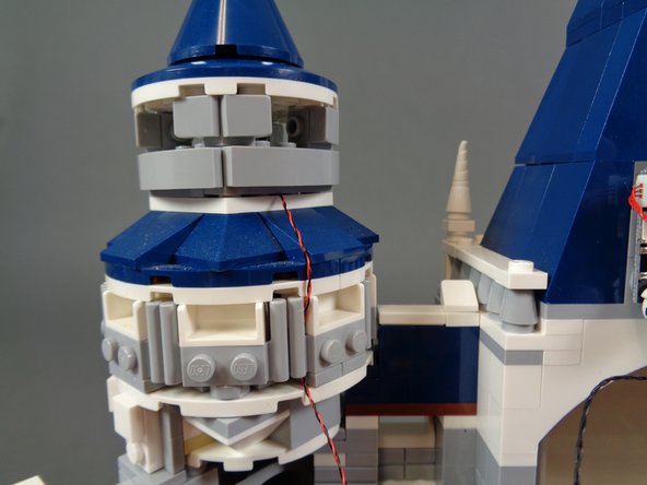 Re-attach the top of the tower.