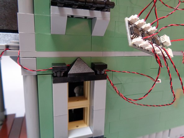 Replace the black window top pieces to hold the side porch light wire in place.