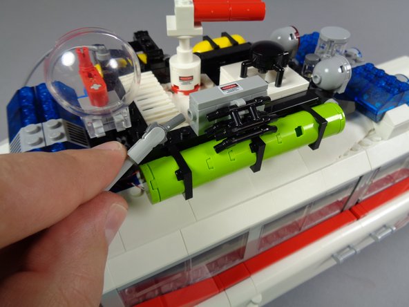 The three photos in this step show some of the parts to re-connect and re-attach.