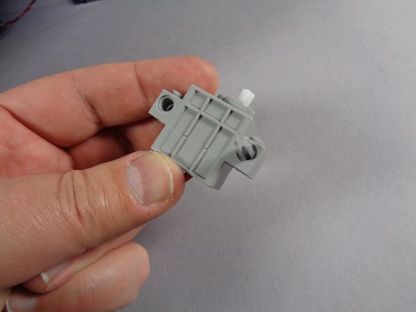 Remove the servo from its bag and also remove the shorter of the light bluish gray Technic axles from the Core Parts bag.  This is the 5-stud length axle.