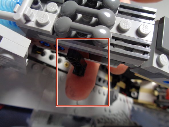 The red rectangles in the second and third photos show where the lever should be mounted.  Make sure it is mounted on the underside of the frame.