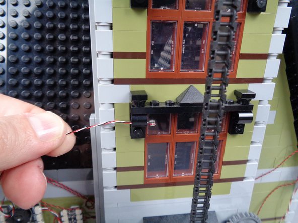 Always make sure to keep the wire away from the elevator chain, so it won't get pulled or caught when the elevator moves.