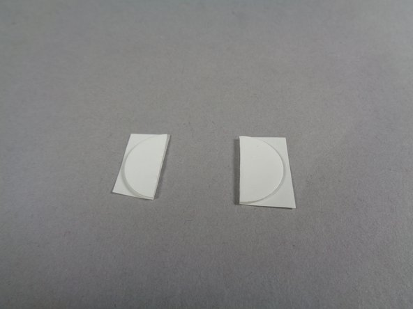 As shown in the first photo for this step, cut the remaining large glue disc in half using a scissors.