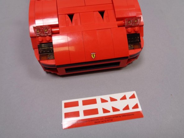 Your lighting kit includes a sheet of red stickers, which are designed to cover the top and sides of the clear headlight slopes.