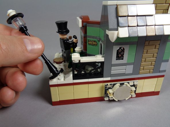 As shown in the first photo, carefully remove the black lamp post including its base.