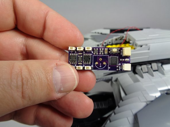 Next you will connect the two guns to the lighting effect controller included with your kit.  Remove the controller from Bag 1.  The controller is shown in the first photo for this step.