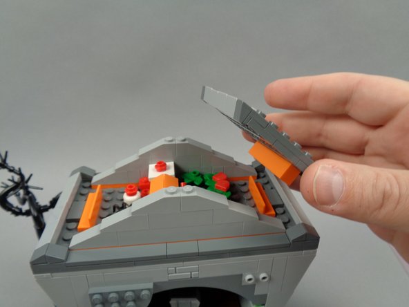 As shown in the third photo for this step, remove both sections of the town hall roof.