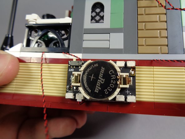 Now you will connect all five light wires to the plugs on the battery board.