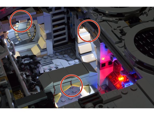Using the BRANCH03 adapter board connected to your Falcon power supply with the power turned on, test each of the five lights you disconnected to find the three doorway lights.  These are shown by the three red circles in the photo.