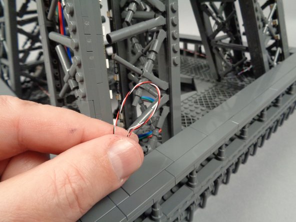 If there are any loose wires, you can tidy them up as shown in the photos by twisting, then tucking inside the nearest pillar.