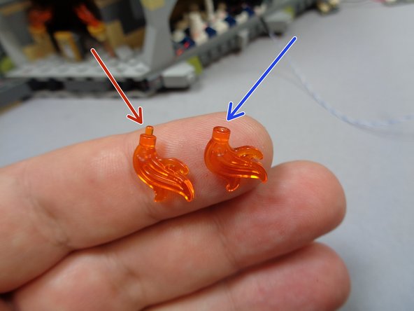 The &quot;Large Flame Pack&quot; bag should contain two replacement flames with the little pins cut off.  See the second photo for an example of the difference between the original part (red arrow) and the Brickstuff-supplied part (blue arrow).