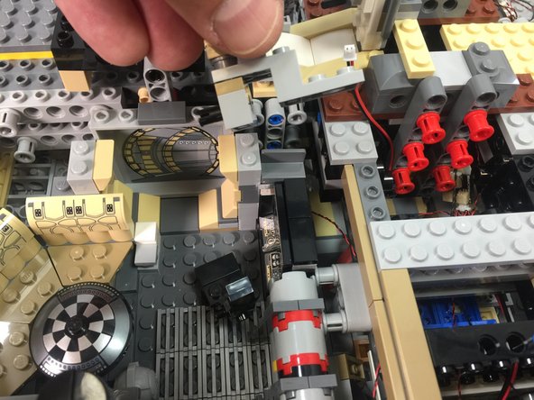 As shown in the photos for this step, remove the frame section next to the doorway, then remove the computer and its panels.