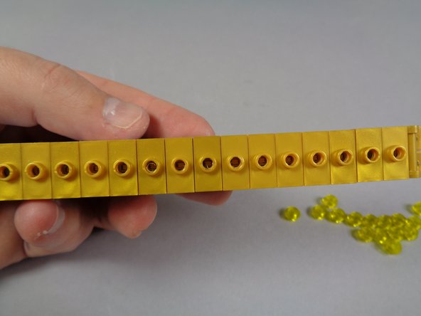 Re-attach the remaining 14 modified gold jumper plates (the ones that came with your Brickstuff kit).  Make sure you are using the jumpers with the holes drilled in the center.