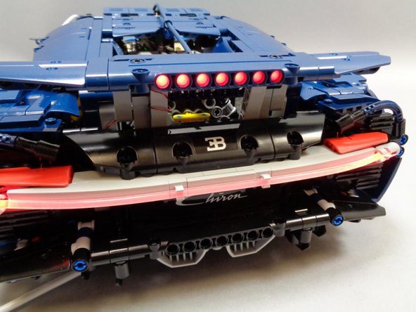 The pre-lit spoiler should still move up and down as freely as it did before you installed the LEDs.  Check to make sure you can still open and close the spoiler, and that it stays up when open.