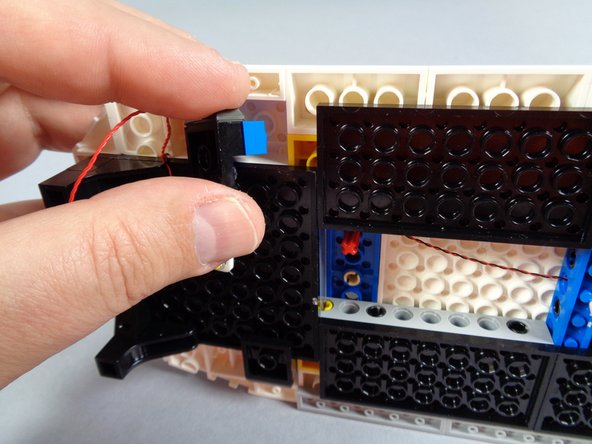 The roof will be fragile until the end of this step, so don't press too hard on the roof slopes.