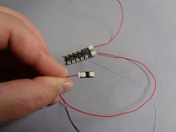 Remove one of these adapters from the Main Parts bag, and leave the other one in the bag for later.