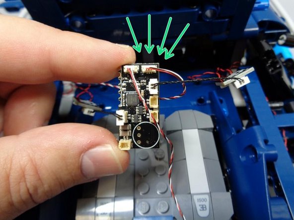 As shown by the green arrows in the third photo, connect the 3-wire headlight control cable to the SENS2 plug in the upper right corner of the main controller board.