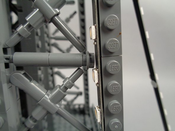 As shown in the photos for this step, you will need to adjust cross-brace elements in the tower frame to make room for the LEDs and strips to fit.