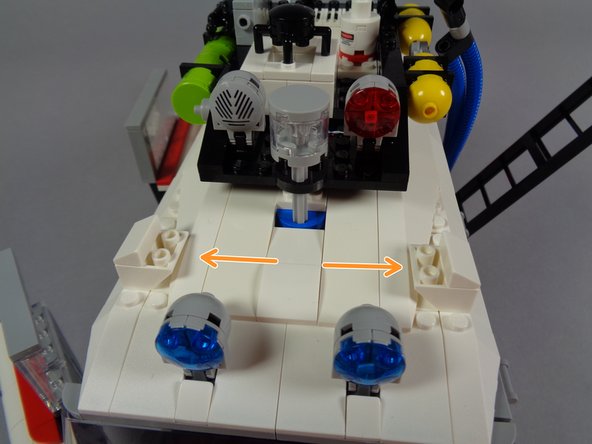 You should now have the roof fully re-assembled, and the two front lightbar mounts should be in place (see the two orange arrows in the third photo).