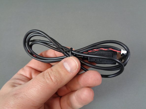 Your kit includes a black USB power cable (as shown in the first photo), which is located inside the box labeled Remote Control and Power.