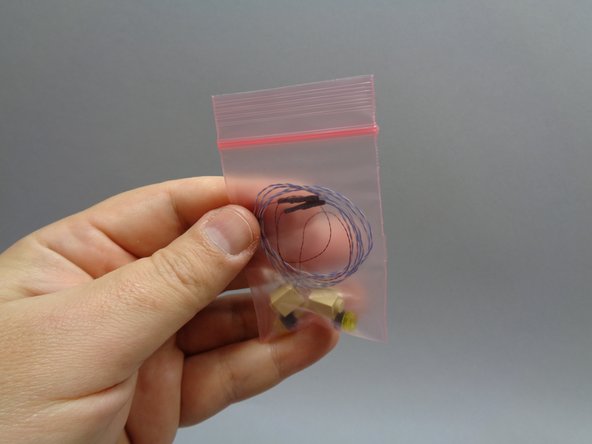 Inside Bag 10 there will be a smaller pink bag with two replacement wall torches (see the third photo).  These have lights pre-mounted.