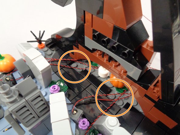 Next, you will organize the wires and re-attach the front of the wave assembly.