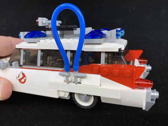 If the antenna wire is not facing downward, gently bend it so it is aligned as shown in the second photo.  Use care when bending so the wire does not snap off.