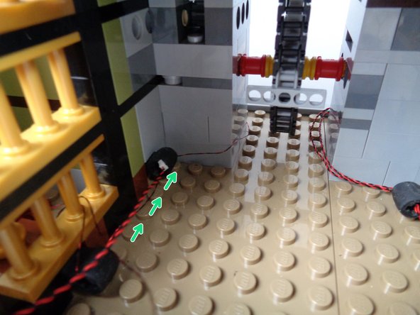 There is a section of black tubing in the middle of the candle light wire that is bulky and which can be difficult to pass through the gap in the bars.  Be careful here, and push from the back of the tubing instead of pulling from the front to get the tubing section through the bars.