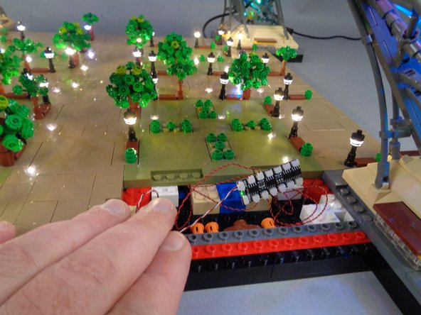 As shown in the photo for this step, next you can connect the six lamp posts on Panel 4 to any six plugs on the BRANCH12X driver board.