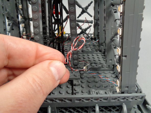 As shown in the photo for this step, you can now tidy up any loose wires in the top section by twisting them together in a bunch.
