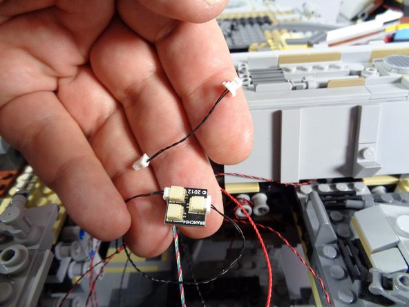 As shown in the photos for this step, you can disconnect the short black wire from the BRANCH04 adapter board as well.