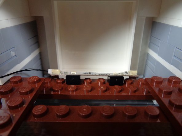 As shown by the green arrow in the third photo, connect the other end of the light strip cable to the OUT1 plug on the TRUNK08 master controller.