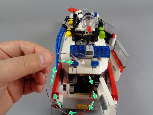 As shown by the orange rectangle in the second photo, check one more time to make sure all wires are positioned away from any gears or elements that move.