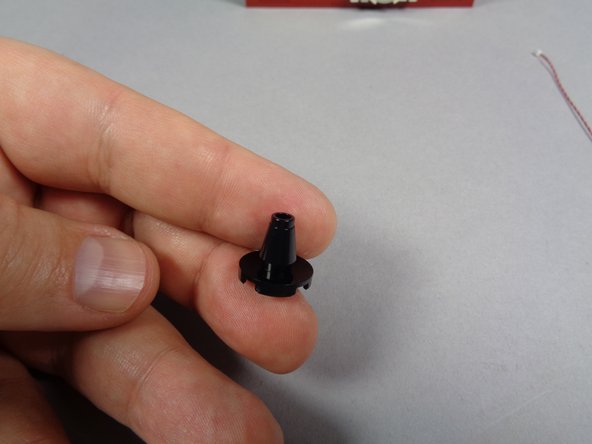 As shown in the first photo, re-assemble the two pieces that form the base of the lamp post.