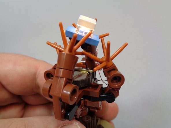 Position your lit car inside the branches, and you are all set!  Because the battery is mounted in the top section of the Willow, you can still spin it around while the light it on.