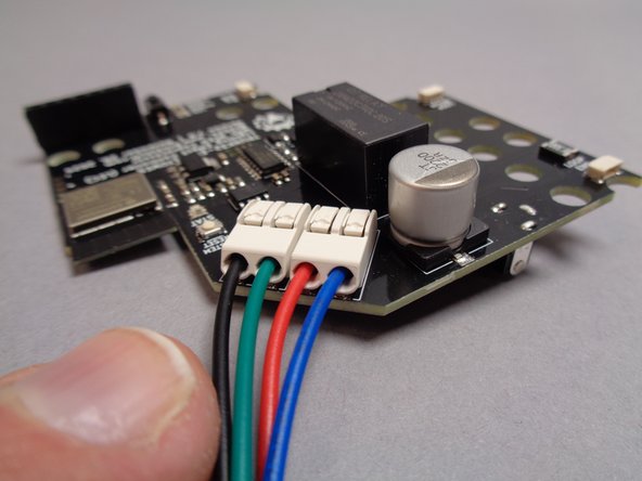 Before proceeding with your installation, check that the four wires connected to the main controller board are firmly inserted into the white terminal blocks, as shown in the first photo for this step.