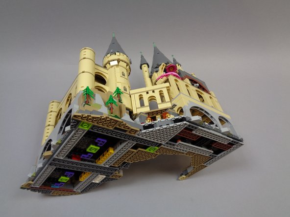 It's time to lay this half of the castle on its side.  The second and third photos show two good places to grip the castle as you slowly turn it and lay it flat.