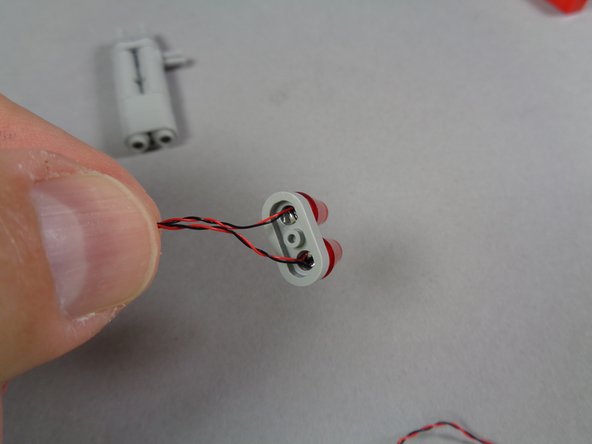 Your tail light assembly should now look like the assembly in the third photo.