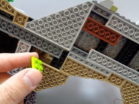 As shown in the first photo, remove the lime green 2x2 plate from the castle base to make room for running the four flame wires.