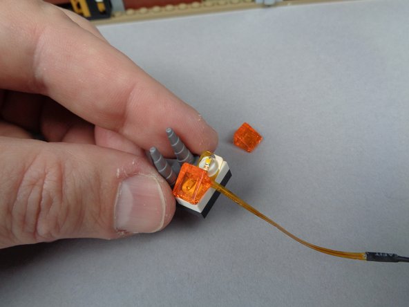 Depending on when your kit was manufactured, the color of the assembly may be yellow as shown in the photos, or it may be a another color.  The operation and installation will be the same.