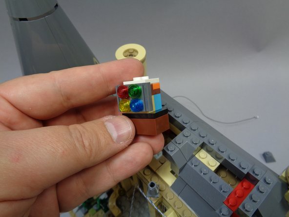 Finally, remove the stained glass window assembly itself as shown in the third photo.